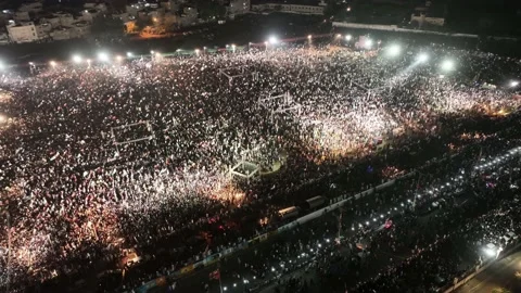 Aerial rotating drone shot of huge crowd in Minar E Pakistan. Stock Footage 194251945