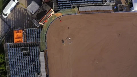Aerial rotating overhead of a baseball field being prepared for a game Stock Footage 127063743