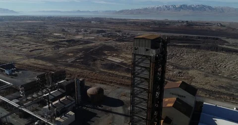 Aerial Rotating Shot of Abandoned Nitrogen Facility in Vineyard, UT Stock Footage 101075596
