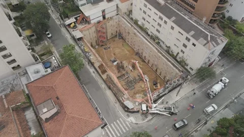 Aerial Rotating Shot of a Building Construction Site with Deep Foundation Stock Footage 321706211