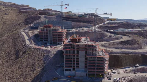 Aerial Rotating Shot Hillside Construction Cranes in Henderson Nevada Video stock 333723341