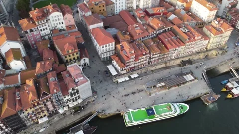 Aerial rotating shot over rooftops and river in porto, portugal Stock Footage 312893006