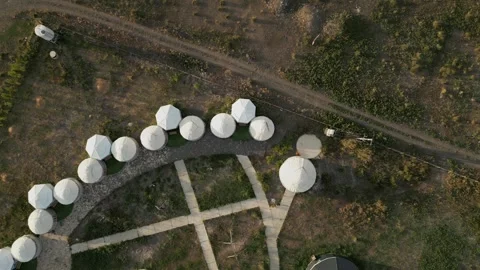 Aerial rotating top down view of yurt camp in Naryn, Kyrgyzstan Video stock 346725276