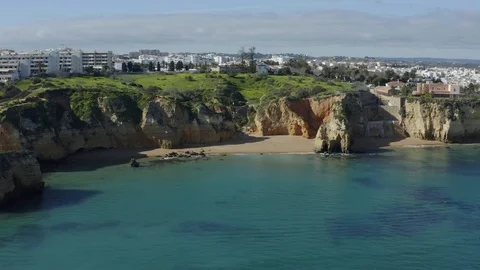 Aerial Rotating View Of Cliffs With Private Sandy Beach In Algarve Stock Footage 128841466
