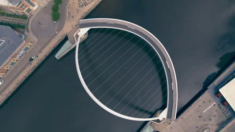 Aerial rotating view of Gateshead Millennium Bridge Stock Footage 336808804