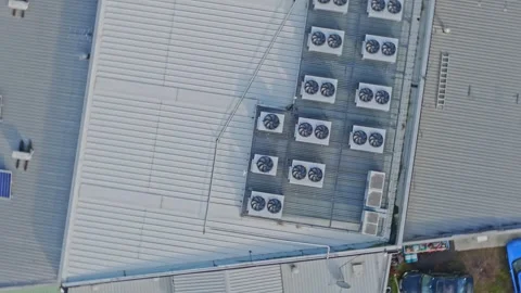 Aerial rotating view of hvac units on a building roof Stock Footage 340595053