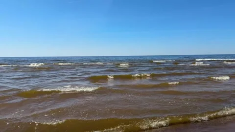 Aerial Rotating View of Ocean Waves and Sandy Beach Stock Footage 334704335