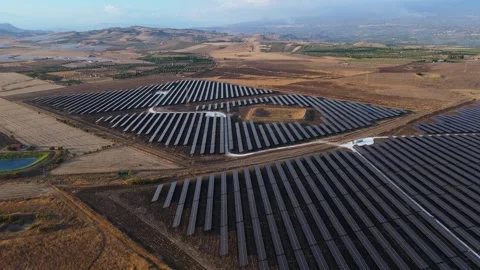 Aerial rotating view of solar panels in a photovoltaic power plant Stock Footage 319641033