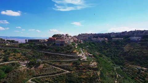 Aerial rotating view of the town of Centuripe in Sicily Stock Footage 293316609