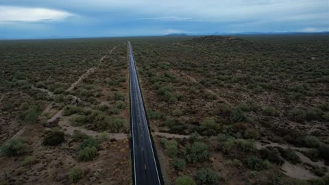 Aerial of a rural highway running through the desert Stock Footage 203981453