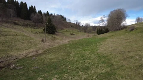 Aerial rural landscape in spring, fields hills and village Germany Stock-Footage 332441727