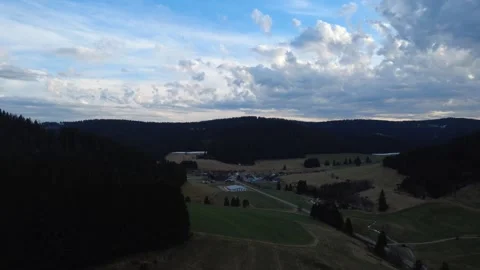 Aerial rural landscape in spring, fields hills and village Germany Stock-Footage 332441746