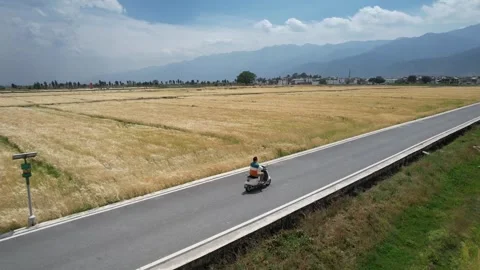 Aerial rural road through fields near Dali Yunnan China Stock Footage 337860883