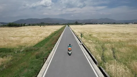 Aerial rural road through fields near Dali Yunnan China Stock Footage 337887549