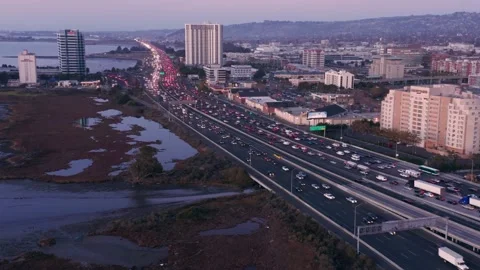 Aerial: Rush hour freeway traffic in Emeryville. Oakland, California, USA Stock Footage 161087387