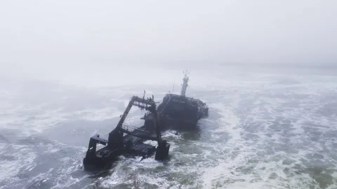 Aerial rusting shipwreck with A frame gantry on Namibia Skeleton Coast Stock Footage 341423418