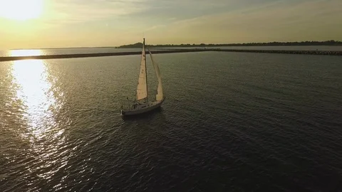 Aerial of a sailboat at sunset Stock Footage 103293353