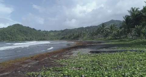 Aerial sailing low over the waves and coastline of Castle Bay, Dominica Video stock 78341026