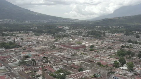 Aerial sails over the rooftops of the colonial town of Antigua, Guatemala Video stock 167941969