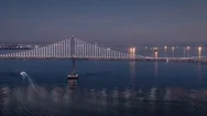 Aerial:  San Francisco Bay Bridge At Night Stock Footage