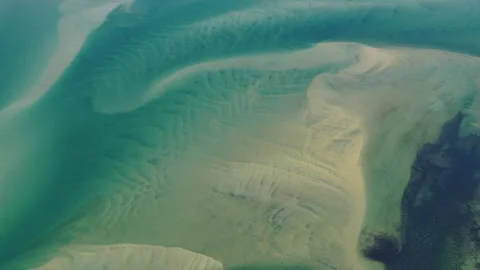 Aerial of Sand Creating Abstract Patterns in a Scenic Cape Cod Bay Stock Footage 341995888