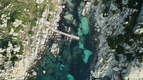 Aerial Sardinia Rocks Coast Blu Water with Dock 4K Stock Footage