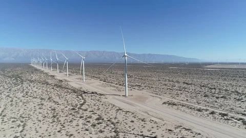 Aerial scene wind field full of aligned wind turbines. Sustainable green energy Video stock 103367968