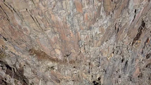Aerial scenic close up view cliffs in Nyack with person sitting and resting Stock Footage 158177453