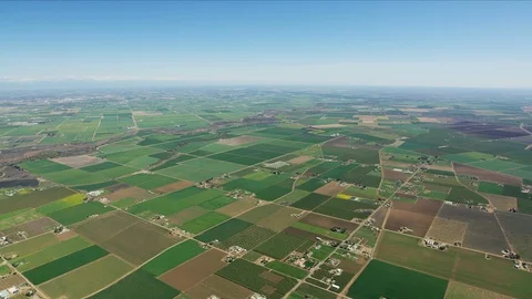 Aerial of scenic patchwork crops fields Central Valley Stock Footage 91545773