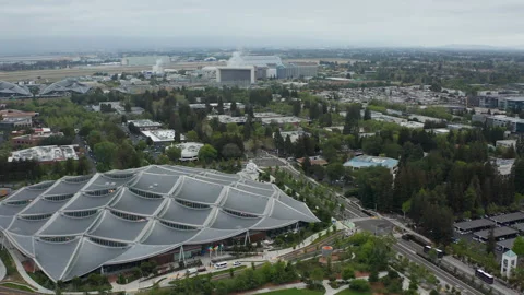 Aerial scenic view of Googleplex Google headquarers in Mountain View in clouds Stock Footage 308208371
