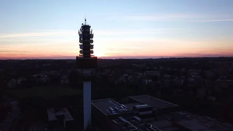 Aerial scenic view of a Telecommunication tower at sunset dishes and antennas Stock Footage 100206602