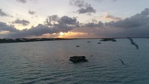 Aerial of sea with rocks on surface with cloudy sky during sunset, Turkey Stock Footage 137975391