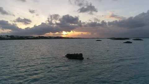 Aerial of sea with rocks on surface with cloudy sky during sunset, Turkey Stock Footage 137975951