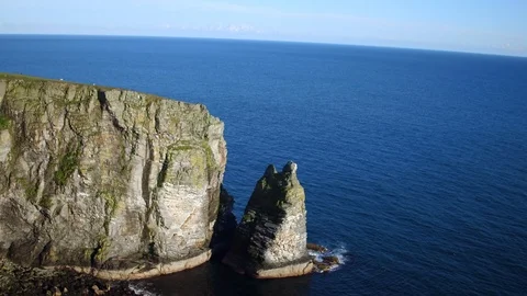 Aerial: Sea stack, Isle of Man. 4K Stock Footage 89779391