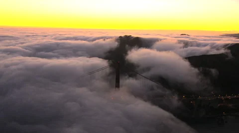 Aerial sea sunset Golden Gate Bridge San Francisco Bay Fog USA Stock Footage