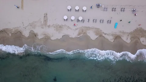 Aerial sea waves roll on empty sand beach on nasty day Stock Footage 103287142