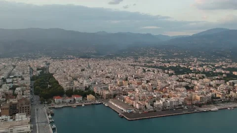 Aerial seaside view over seaside city of Kalamata, Greece at sunset Stock Footage 164589357