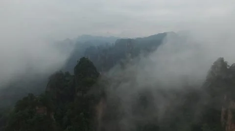 AERIAL SEQUENCE OF TIANZI MOUNTAIN STEEP ROCK CLIFFS IN THE AVATAR MOUNTAINS Stock Footage 65204305