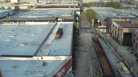 Aerial settle into train yard in industrial Brooklyn New York City Stock Footage 164014811