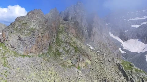 Aerial sharp rocky alpine peaks and exposed ridges - Ranges Rugged and Absaroka Stock Footage 339425083