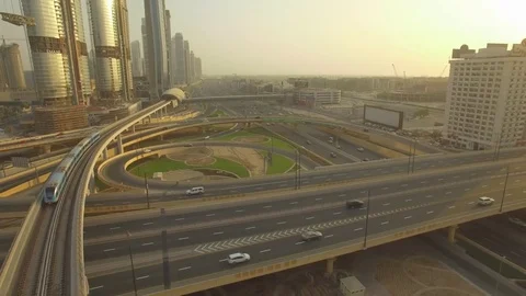 Aerial. Sheikh Zayed Road Intersection and Dubai Metro train. 4K. Stock Footage 79904700