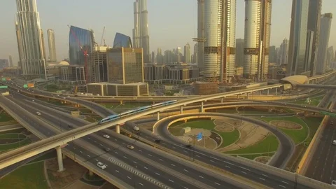 Aerial. Sheikh Zayed Road Intersection and Dubai Metro train. 4K. Stockbeeldmateriaal 79904752