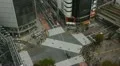 Aerial Shibuya Crossing Tokyo Crowded Sidewalk Train Passing People Walk Crowd HD Footage