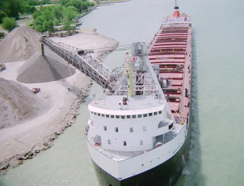 Aerial on ship offloading ore 1989 Stock Footage 136123559