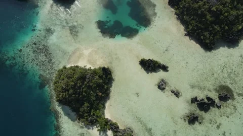 Aerial shoot, flight over colourful lagoon with Turquoise water, sand beach Stock Footage 261407945