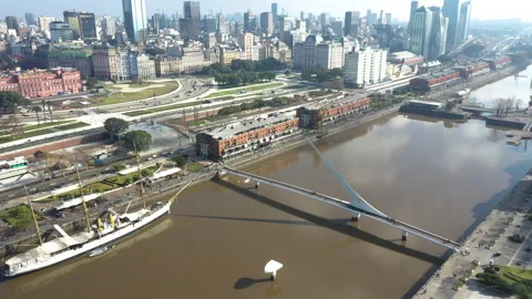 Aerial Shoot going back in Puerto Madero looking Woman Bridge Stock Footage 139562780