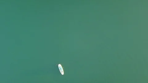 Aerial shoot of A group of SUP surfers floating in Harfravatn lake in Iceland Stock Footage 118348267