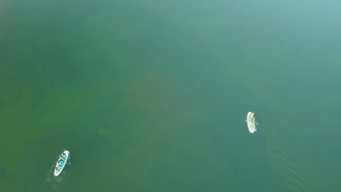 Aerial Shoot Of A Group Of Sup Surfers Floating In Harfravatn Lake In Iceland Stock Footage 118360733