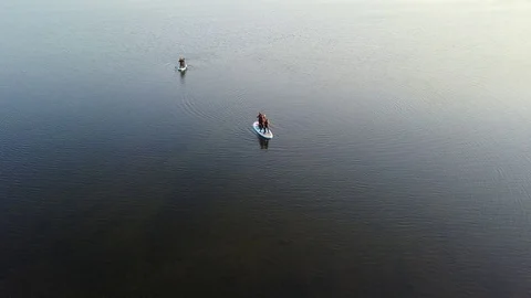 Aerial Shoot Of A Group Of Sup Surfers Floating In Harfravatn Lake In Iceland Stock Footage 118373443