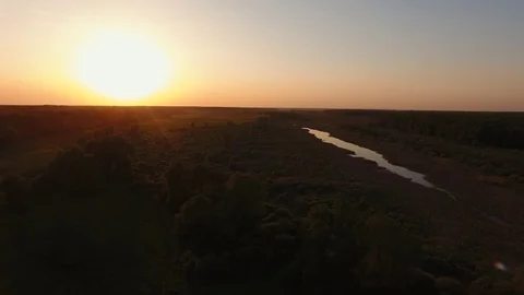 Aerial shooting flying along the river at sunset Stock Footage